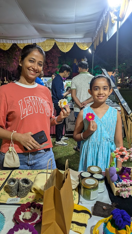 Customers holding Kalatri crochet flowers